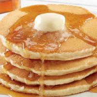 Buttermilk Hotcakes · Four buttermilk hotcakes served with butter and syrup and your choice of premium breakfast m...