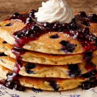 Double Blueberry Hotcakes · Four blueberry hotcakes topped with blueberry topping, whipped topping and powdered sugar. S...