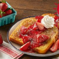 Fresh Berry French Toast · Two slices of thick-cut brioche French toast topped with vine-ripened strawberries, strawber...