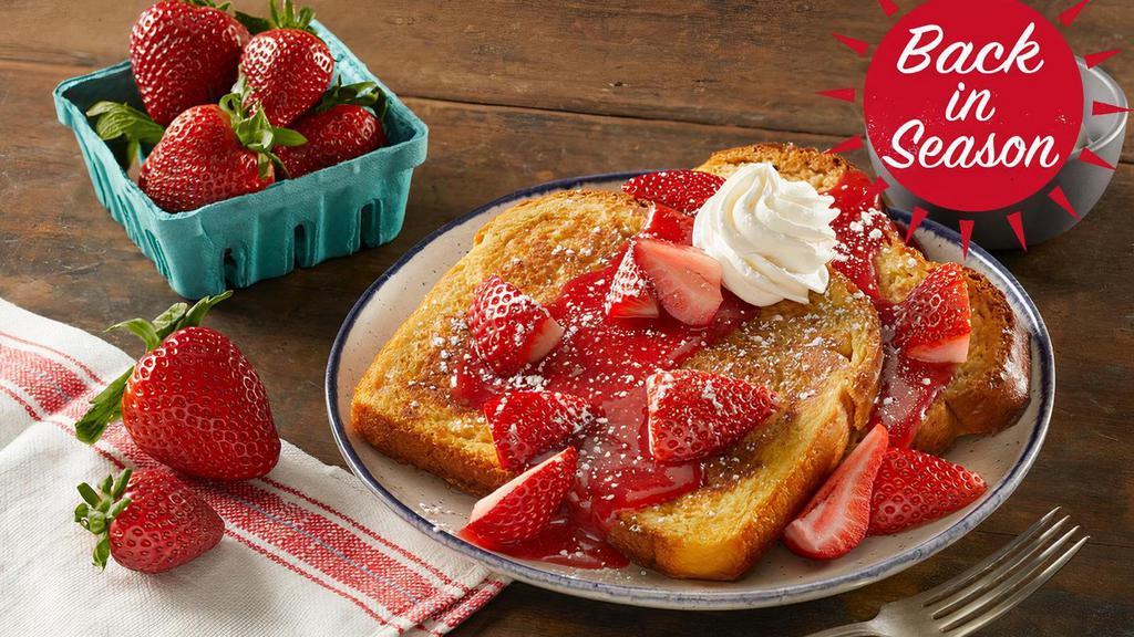 Fresh Berry French Toast · Two slices of thick-cut brioche French toast topped with vine-ripened strawberries, strawberry sauce, powdered sugar and whipped topping. Served with your choice of premium breakfast meat or fresh fruit.