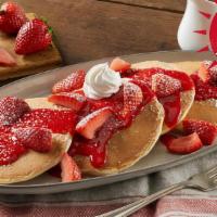 Fresh Berry Hotcakes · Four buttermilk hotcakes topped with vine-ripened strawberries, strawberry sauce, powdered s...