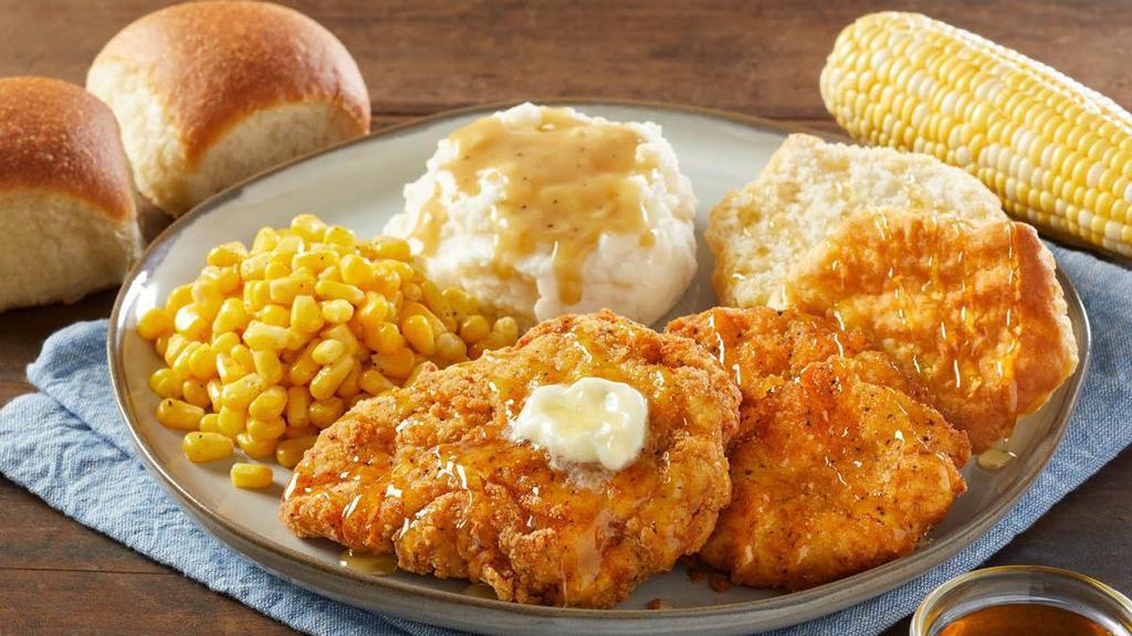 Honey Butter Chicken And Biscuit · Two hand-breaded fried chicken breasts with real clover honey, butter, one split biscuit, and your choice of two sides