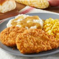 Hand-Breaded Fried Chicken  · Two hand-breaded all white meat chicken breasts served with 2 sides and freshly baked rolls