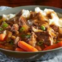 Fork-Tender Pot Roast · Slow-roasted for nine hours and served with carrots, caramelized onions, mashed potatoes and...