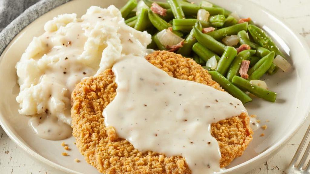 Country-Fried Steak · Smothered with country gravy and served with choice of two sides and dinner rolls