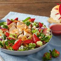 Summer Berry Salad · Enjoy a burst of vine-ripened strawberries with chicken grilled-to-perfection, pecans and re...