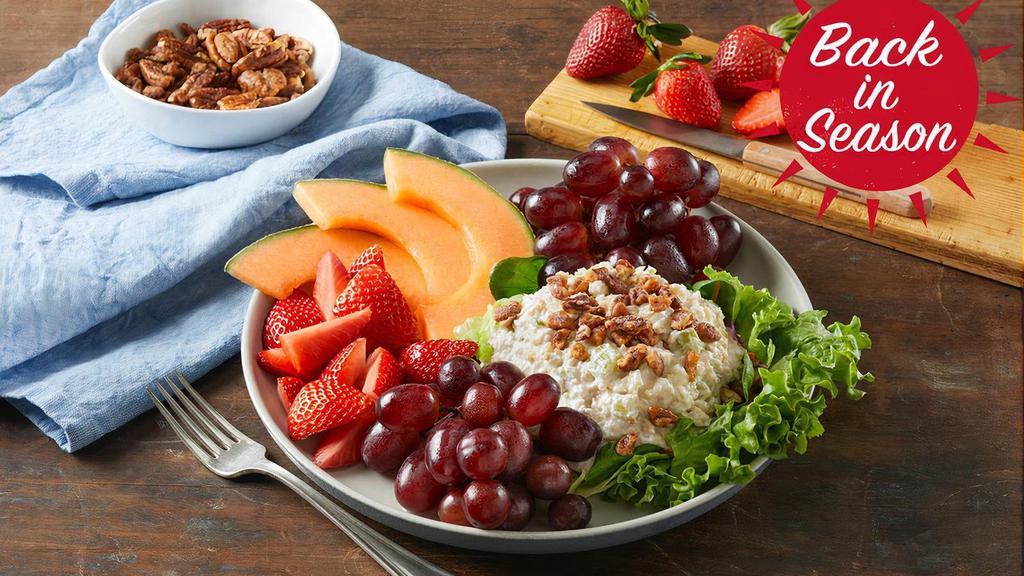 Chicken Salad Fruit Plate · Tender, all-white-meat chicken salad atop a bed of fresh lettuce with fresh-sliced cantaloupe, vine-ripened strawberries and grapes, topped with pecans.