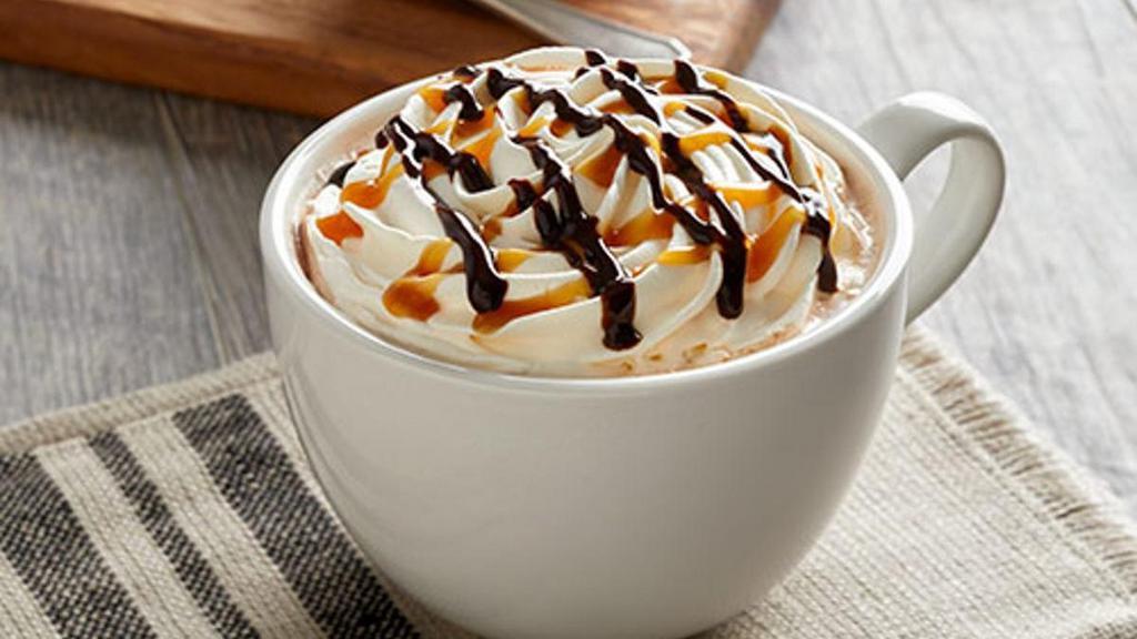 Caramel Mocha · A blend of hot chocolate, our Bold Coffee and a splash of caramel. Finished with whipped topping and drizzles of caramel and chocolate sauces.