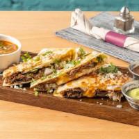 Barrio Birria Quesadilla · Slow cooked lamb barbacoa, queso fresco, oaxaca cheese, chihuahua cheese, white onion, guaca...