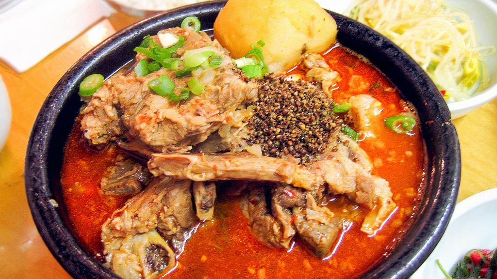 Gam Ja Tang (S) /  감자탕 · Potato  & Pork's Backbone w/ Assorted Vegetable in Spicy Broth
