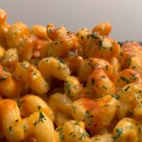 Buffalo Mac'N Cheez · Vegan. Cavatappi pasta with a house made creamy vegan cheez sauce (oat and soy based). Toppe...
