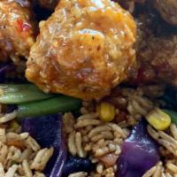 Sweet Chili Bites With Veggie Fried Rice · Vegan. Crispy soy protein doused in an Asian sweet chili sauce served with vegetable fried r...