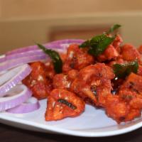 Gobi 65 · Spicy. Deep fried cauliflower marinated with aromatic spices and yogurt.