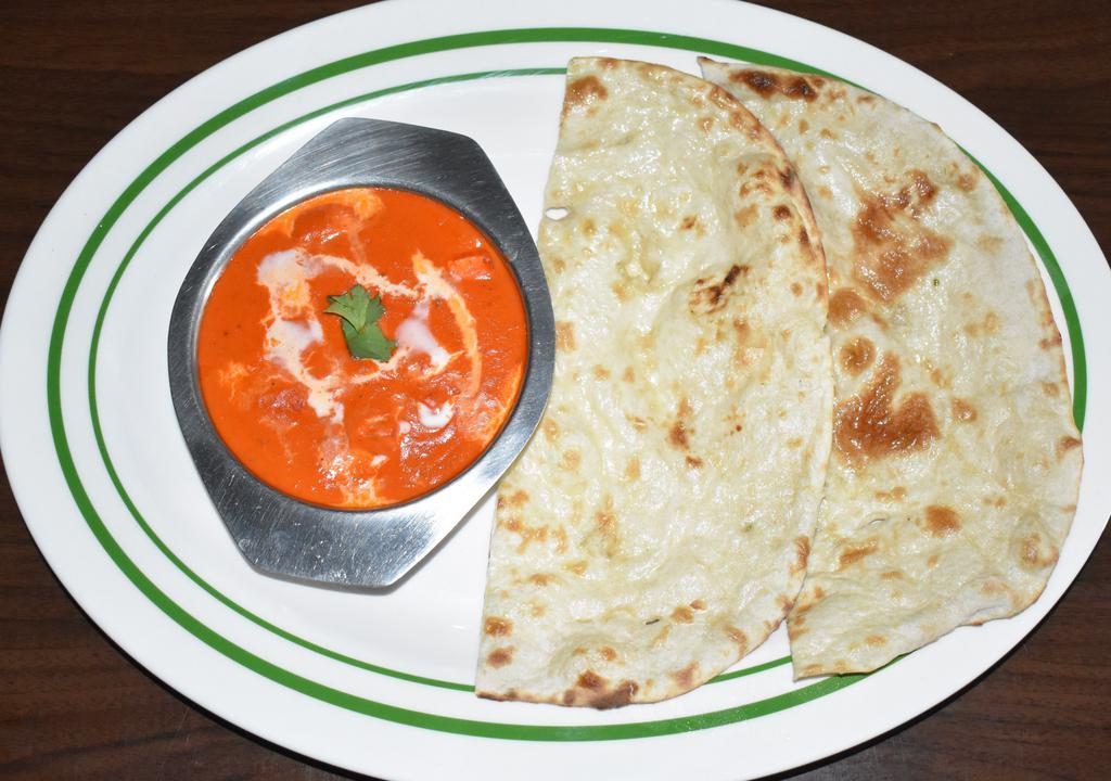Paneer Butter Masala · Cottage cheese cooked with creamy sauce.