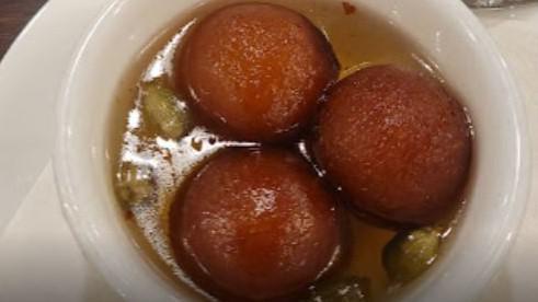 Gulab Jamun · Solidified milk balls, deep fried with warm sugar syrup.