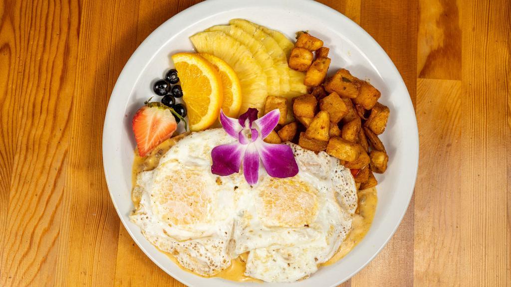 O.S. · Two Eggs over easy, served on a toasted english muffin dredged in a creole style sausage gravy, served with home fries.