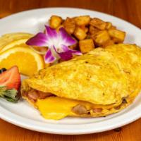 Farmers Omelette · Crispy bacon, sausage, ham, peppers, onions, home fries with melted american cheese and serv...