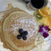The Layover Stack · Your choice of pancakes, french toast, or waffles (short stack or tall), all served with whi...