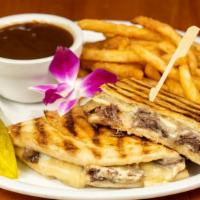 Short Rib & White Cheddar Panini · Tender braised boneless short rib topped with sliced melted cheddar  cheese and roasted garl...
