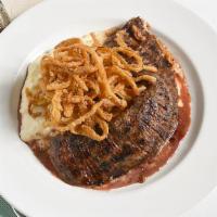 Marinated Skirt Steak · Whipped potatoes, crispy onions in a Demi glaze.