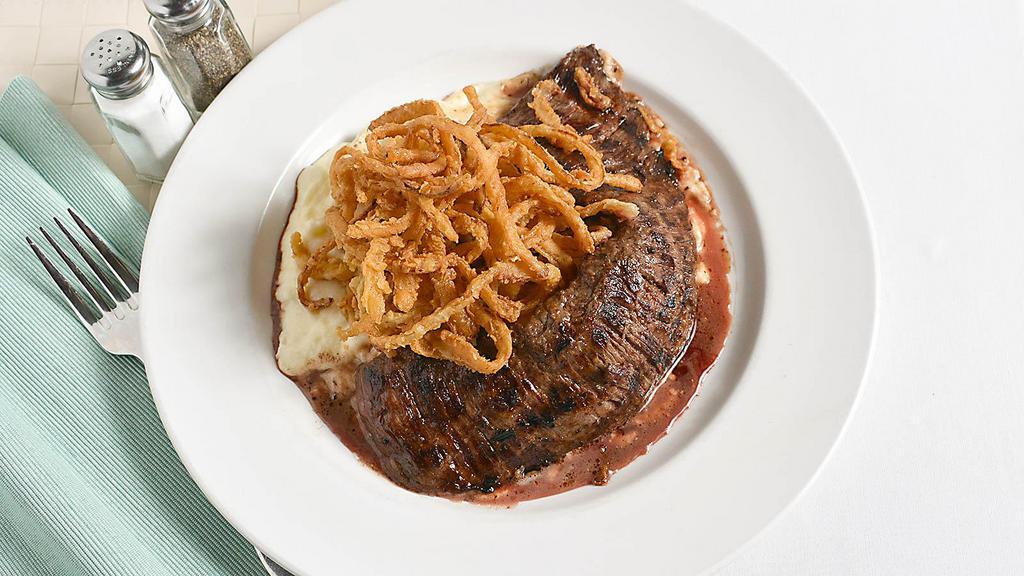 Marinated Skirt Steak · Whipped potatoes, crispy onions in a Demi glaze.