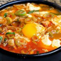 Sundubu Stew · Spicy soft tofu stew with rice.