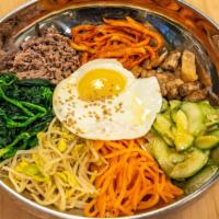 Bibimbap · Rice topped with meat or assorted vegetables and egg.