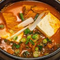 Kimchi Stew · Spicy. Traditional Korean spicy kimchi stew with tofu and pork. With rice bowl.