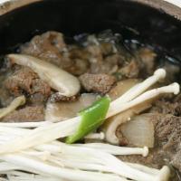 Ttukbaegi Bulgogi · Hot pot sliced tender beef with clear noodle  With rice bowl.