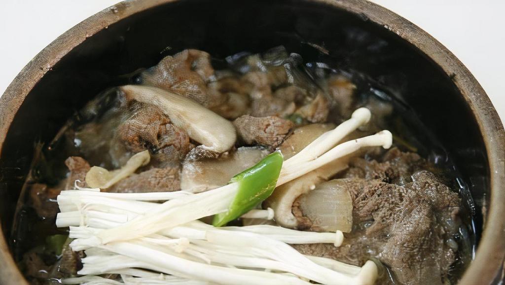 Ttukbaegi Bulgogi · Hot pot sliced tender beef with clear noodle  With rice bowl.