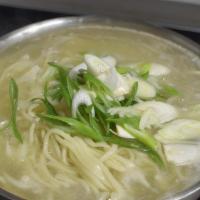 Kalguksu · Hand-made noodles in soup.