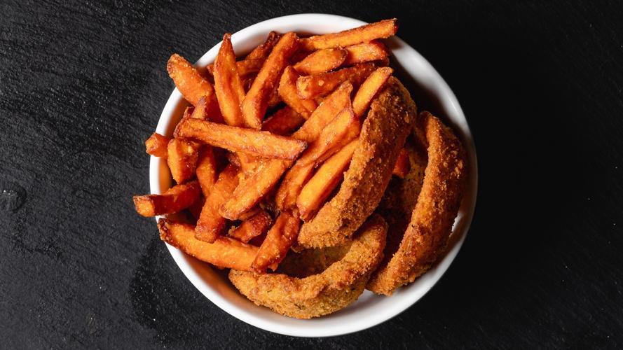 Side Onion Rings & Organic Sweet Fries · A mix of organic sweet potatoes & breaded onion rings. (330 cal)