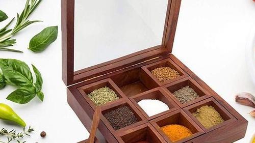 Spice Box · Nine container to have different items you can use as per your requirement.
A must have in your kitchen, Use these multi utility Wooden box to store your spices & more
Gift Item-This product can also be gifted proudly to your friends and relatives on any occasion
As this product is Handcrafted there might be a slight color & shape variation which is natural and hence makes the product unique.
Size & Contains: 8