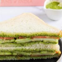 Karma Sandwich · White Bread, light butter, cilantro chutney sauce, potato, tomato, onion, cucumber & seasoni...