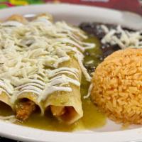 Enchiladas Verdes · Two chicken or beef enchiladas topped with our special green sauce and cheese. Served with r...
