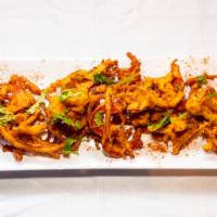 Pakoras · Mixed vegetable dipped in spicy batter and deep fried.