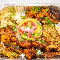 Mix Grill · Chicken seekh kebab, chicken hariyalli reshmi kebab, lamb boti, and tandoori wings. Served w...