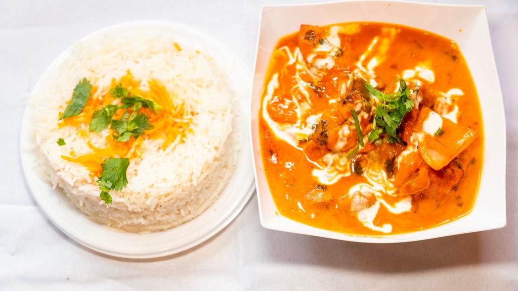 Chicken Tikka Masala · Boneless chicken, onion, tomato, and bell peppers cooked with mild spices.