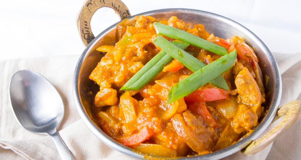 Chicken Karahi · Cut pieces of chicken sauteed with special Indian seasoning with fresh tomatoes, onions and green peppers.