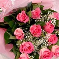 Pink Dozen Roses · beautiful light pink roses with babys breath and leather leaf greens