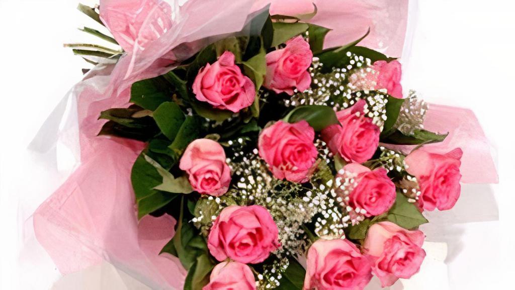 Pink Dozen Roses · beautiful light pink roses with babys breath and leather leaf greens