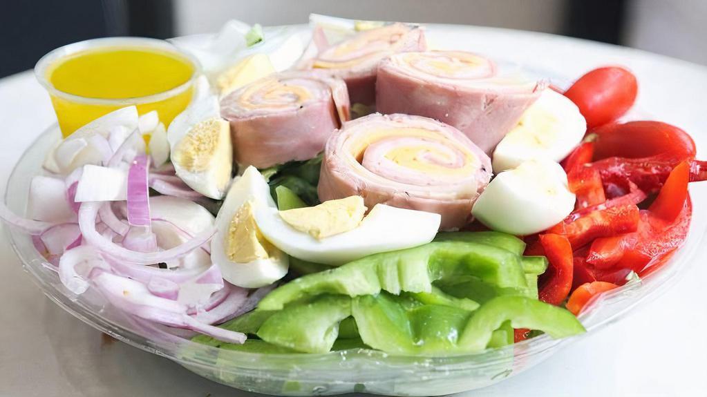 Traditional Chef'S Salad · Turkey,ham,swiss& American cheese, hard boiled eggs and cucumber over mixed greens.