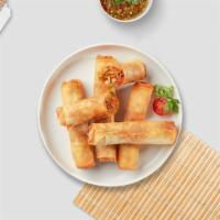 Spring Roll · Seasonal vegetables wrapped in rice wrapper and fried until golden crisp