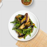 Eggplant String Bean · Sauteed eggplant in basil garlic sauce on a bed of string beans.