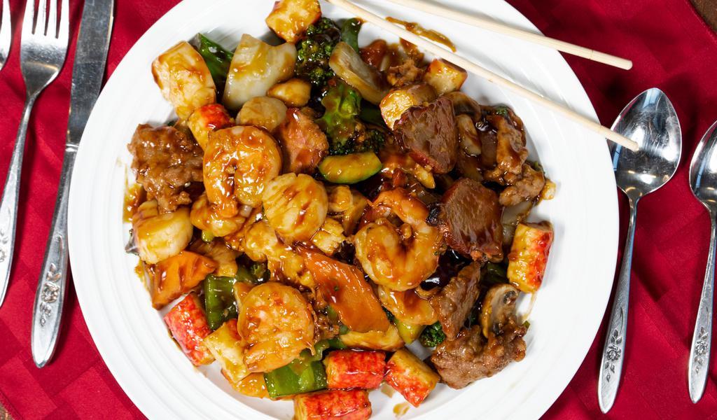 Happy Family · Lobster, shrimp, scallop, roast pork, chicken, beef, crab meat with mixed vegetables in brown sauce.