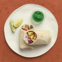 Saag Paneer Burrito · Savory spinach and cheese with basmati rice, diced cucumber and tomato, shredded cabbage, an...