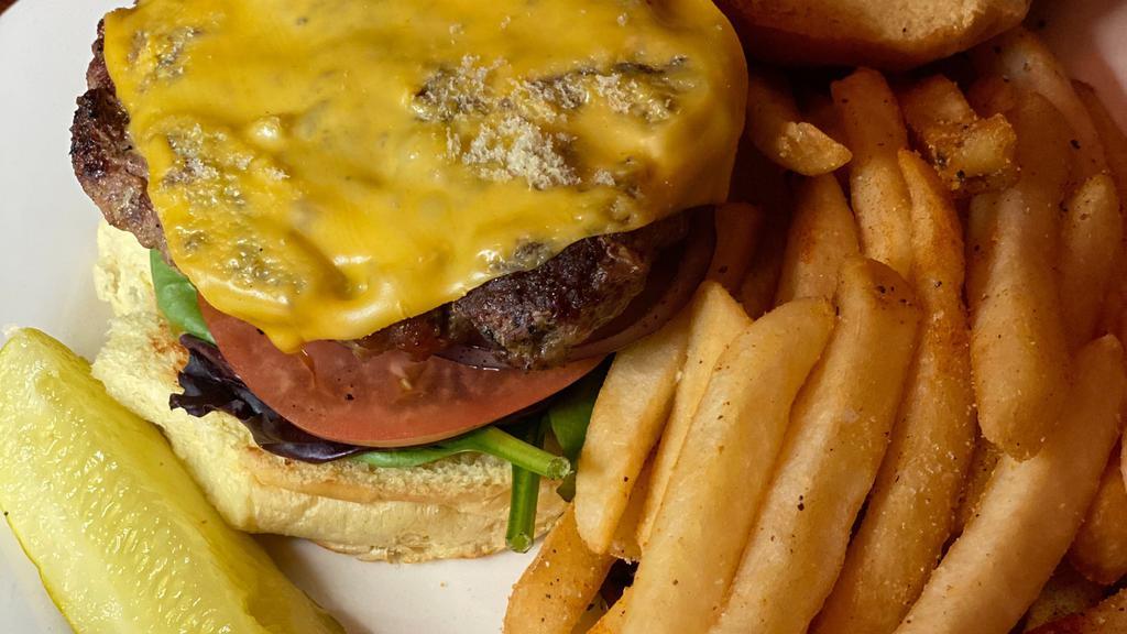 Beef Burger · Served w/ lettuce, tomato, pickles, and french fries or salad