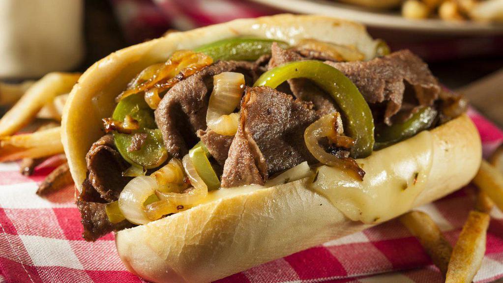 Philly Cheese Steak With Bacon Deluxe · Juicy thinly sliced beef steak, crispy bacon, onions, green peppers, and creamy cheese served between a buttery toasted hero with a side of fries and a drink.