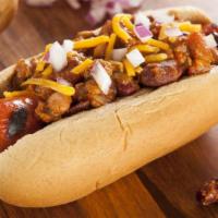 Bacon Chili Cheese Dog · Juicy hot dog and crispy bacon topped with hearty chili and creamy cheese served in toasted ...