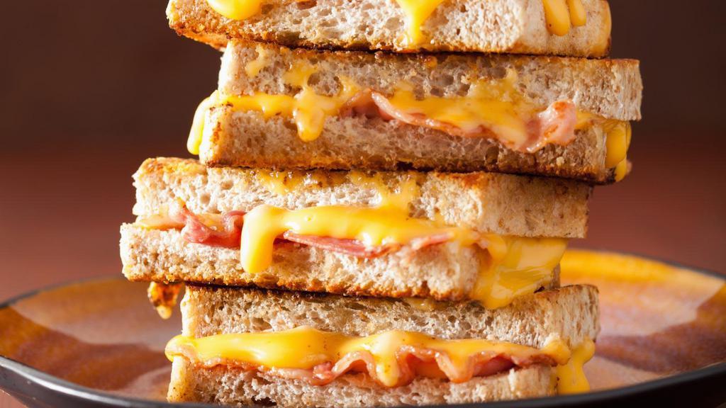 Grilled Cheese With Bacon · Crispy bacon and creamy cheese melted between buttery toasted bread.